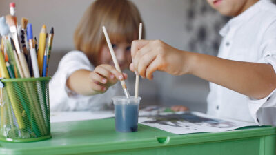 Young children painting at school