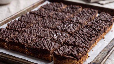 Tray of brownie flapjack squares, freshly baked and cut